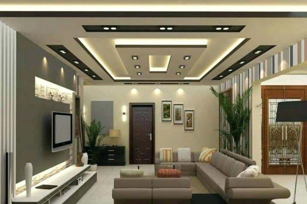 The Living room boasts an  eye-catching false ceiling